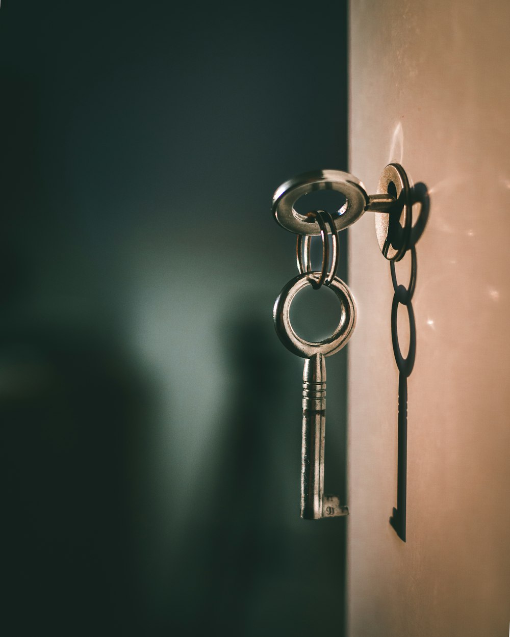 An old iron key set in a keyhole